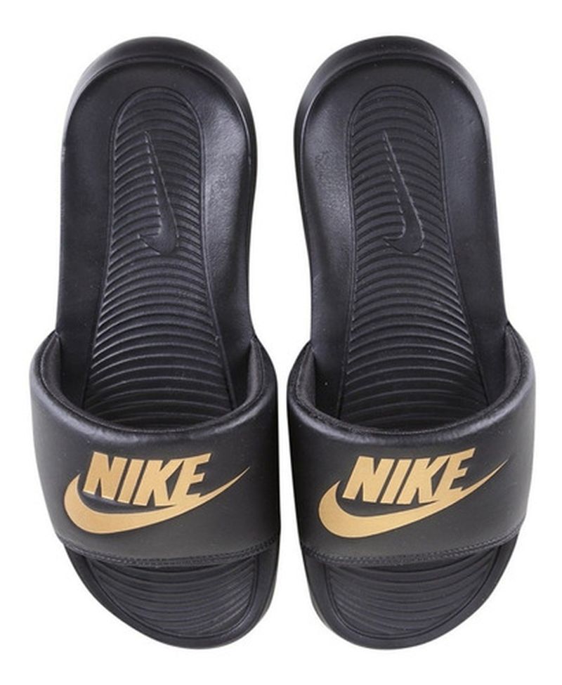 Chinelo nike hot sale simbolo dourado